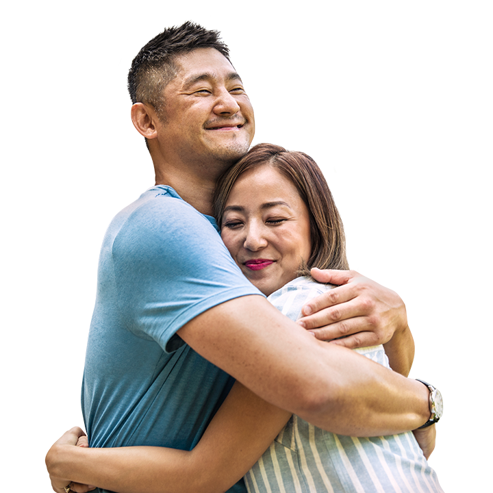 middle-aged asian couple hugging